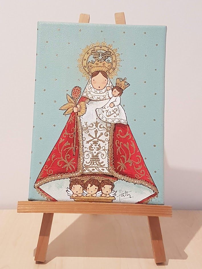 Pintura de la Virgen de la Cabeza con el Niño Jesús en brazos, ambos coronados, con fondo celeste decorado con puntos dorados